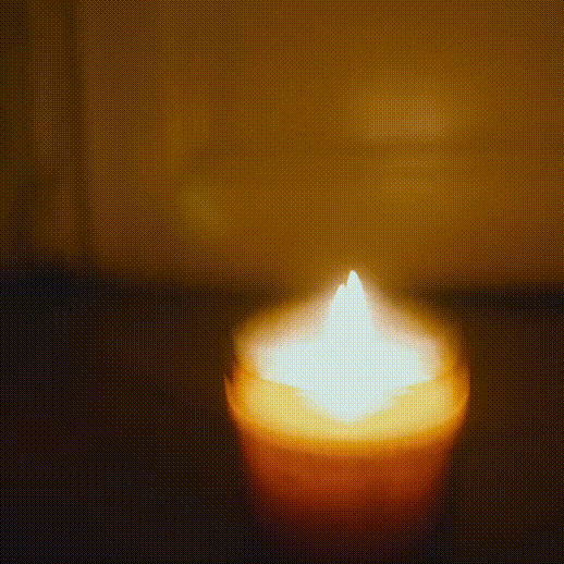 Flickering light against the dark.